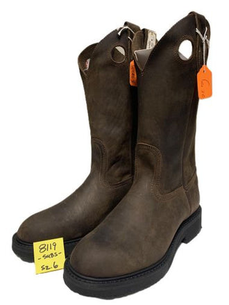 A pair of dark brown leather cowboy boots with circular cutouts near the top, black soles, and orange hang tags, shown on a white background with a yellow price tag in the foreground.