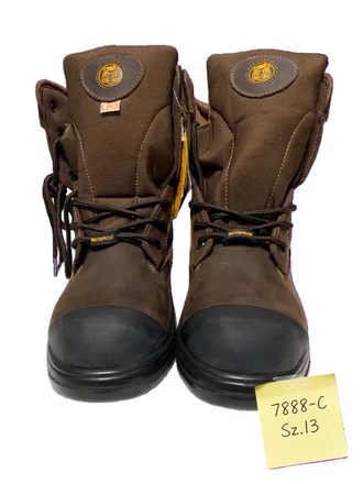 A pair of brown work boots with black rubber toe caps and laces, shown against a white background with a yellow sticky note in the bottom right corner.